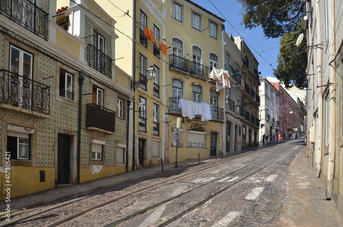 The beautiful residential area of Lisbon, with old buildings and quite street. © peacefoo
