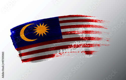 Malaysia flag illustrated on paint brush stroke