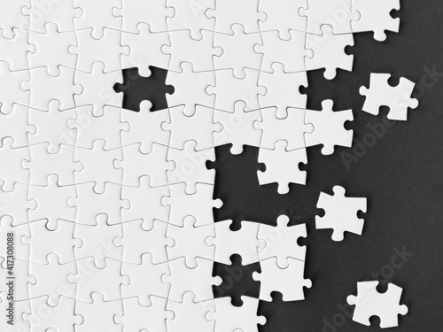 White jigsaw puzzle on black background