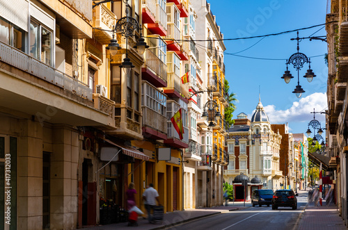 Picturesque architecture of typical narrow street in historic center of Spanish city of Cartagena on summer day © JackF