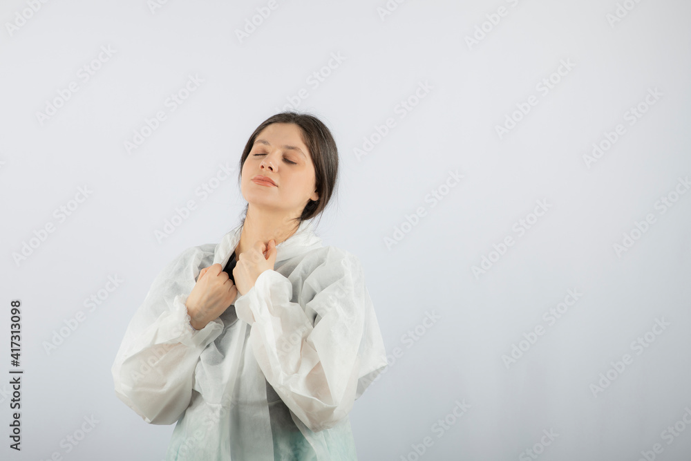 Portrait of young female doctor scientist in defensive lab coat Portrait of young female doctor scientist in defensive lab coat