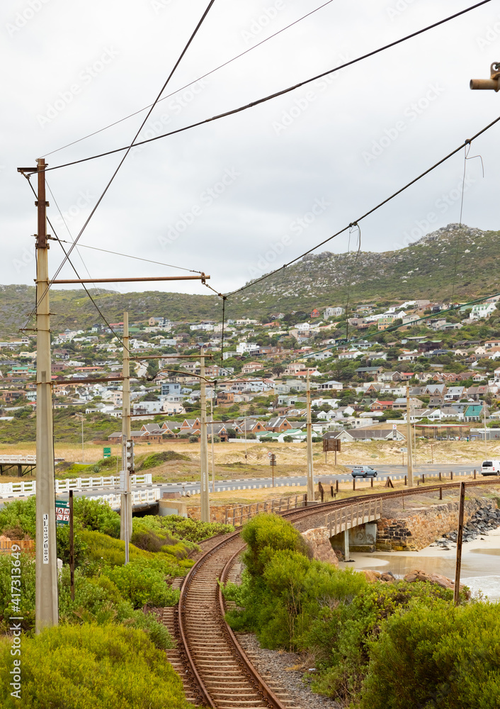 Electric Passenger Railway line on the shoreline of Glencairn beach, False Bay Electric Passenger Railway line on the shoreline of Glencairn beach, False Bay