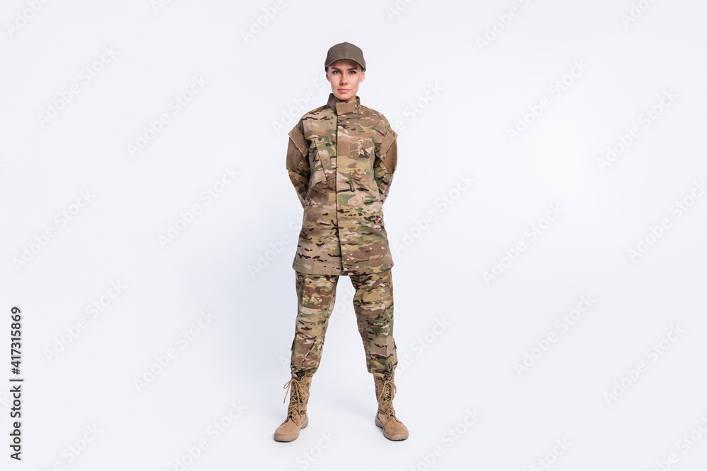 Full body photo of young woman confident soldier officer army camouflage uniform isolated over white color background Full body photo of young woman confident soldier officer army camouflage uniform isolated over white color background