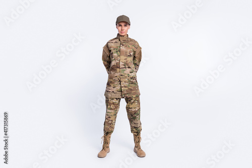 Full body photo of young woman confident soldier officer army camouflage uniform isolated over white color background