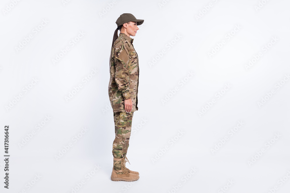 Full body profile portrait of young girl standing look empty space calm face isolated on white color background Full body profile portrait of young girl standing look empty space calm face isolated on white color background