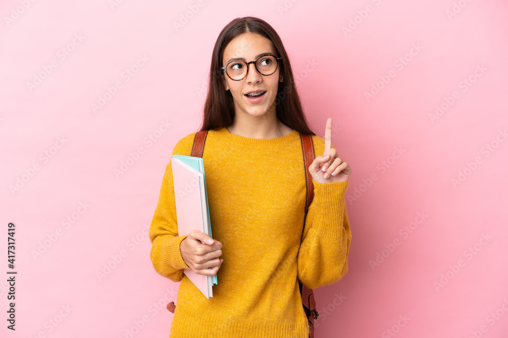 Young student woman over isolated background thinking an idea pointing the finger up Young student woman over isolated background thinking an idea pointing the finger up