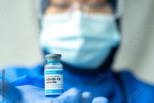 Medical concept ampoules or vials with Covid-19 vaccine on a laboratory bench.