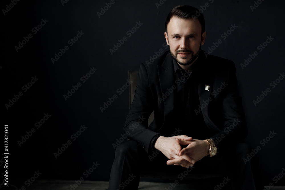 Portrait of a handsome man in black suit indoor Portrait of a handsome man in black suit indoor