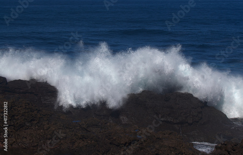 Gran Canaria, north coast, area around Punta Sardina cape, powerful foamy ocean waves breaking along the shore 