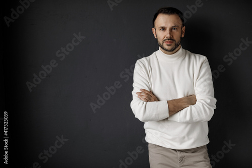 Portrait of a handsome man in white clothes indoor