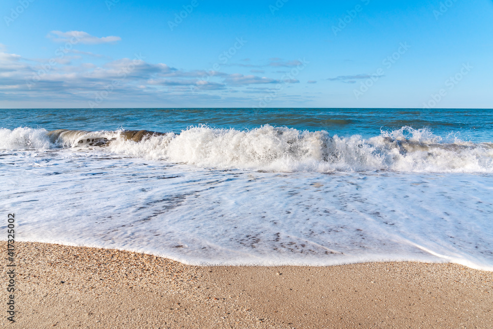 Empty beach with yellow sand and blue waves, quarantine at the resort Empty beach with yellow sand and blue waves, quarantine at the resort