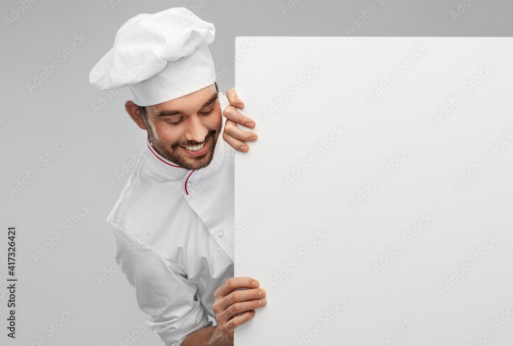 cooking, culinary and people concept - happy smiling male chef in toque with big white board over grey background cooking, culinary and people concept - happy smiling male chef in toque with big white board over grey background