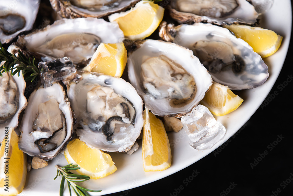 fresh oysters with lemon in ice fresh oysters with lemon in ice