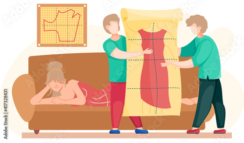 Planning model of future garment. Professional tailoring studio. Sewing clothes. Tailors holding poster with dress pattern. Girl lying on couch and looking at design mockup of unfinished dress