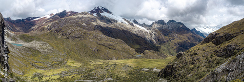 huge beautiful panorama landscape with enormous mountains with ice and a lake in huaraz, peru