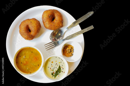 Top view of prepared Medu vada served with toppings photo