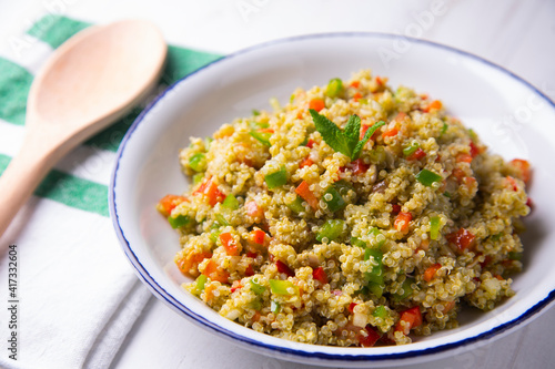 Quinoa salad with vegetables and mint oil