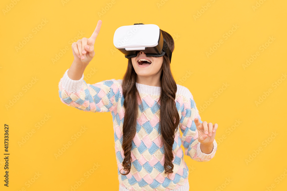 using VR headset. kid play video game. Digital future and innovation. child in virtual goggles using VR headset. kid play video game. Digital future and innovation. child in virtual goggles