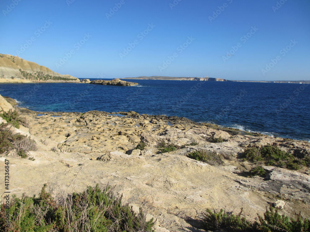 Secluded rocky bay on the island of Gozo 
