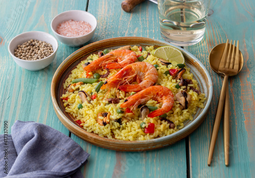 Spanish paella with seafood, shrimp and vegetables. Healthy eating. Spanish cuisine.