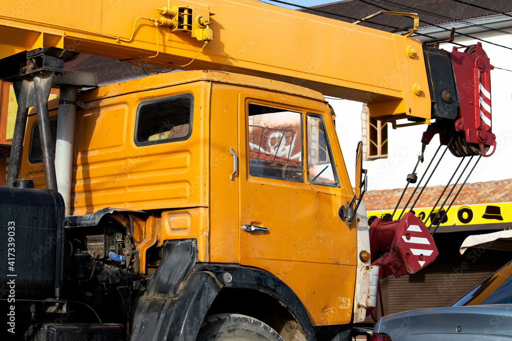 Yellow car crane. A sunny autumn day is a side view. Yellow car crane. A sunny autumn day is a side view.