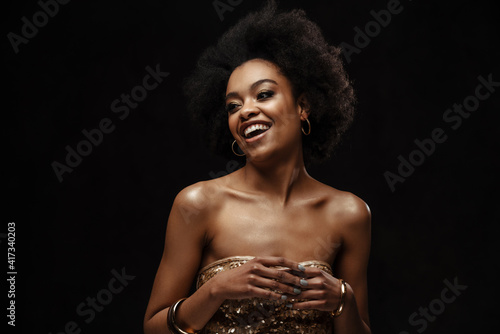 Wallpaper Mural Happy african american woman in party dress laughing at camera Torontodigital.ca