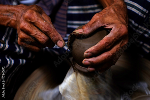 Professional thai old man using mechanic pottery made earthenware at Koh Kret in Nonthaburi Thailand © srckomkrit
