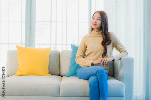 Portrait beautiful young asian woman relax leisure enjoy on sofa