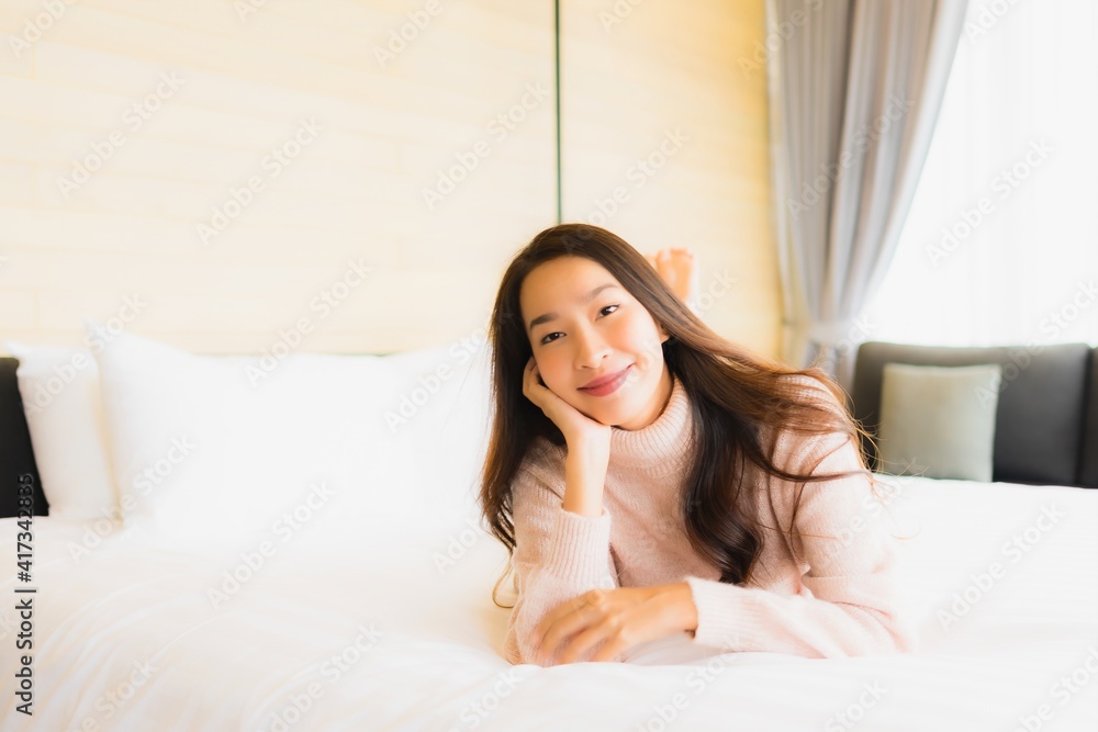 Portrait beautiful young asian woman happy smile relax on bed Portrait beautiful young asian woman happy smile relax on bed