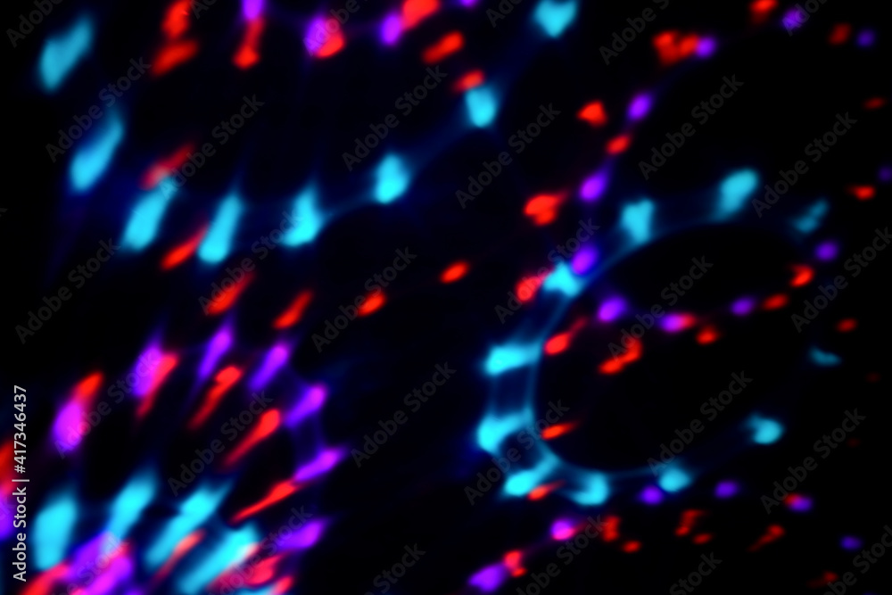Blur colorful neon light leaks on black background. Defocused illuminated abstract futuristic texture for using over photos as overlay or screen filter