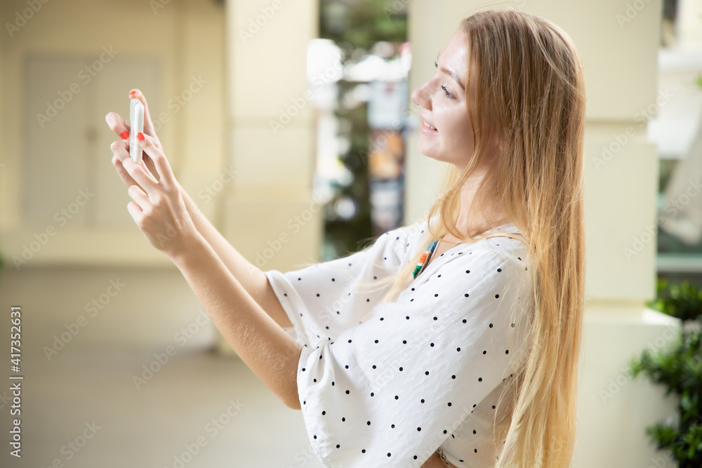 woman taking smartphone photography, white woman taking mobile or smartphone photo, snapshot, smart phone video recording