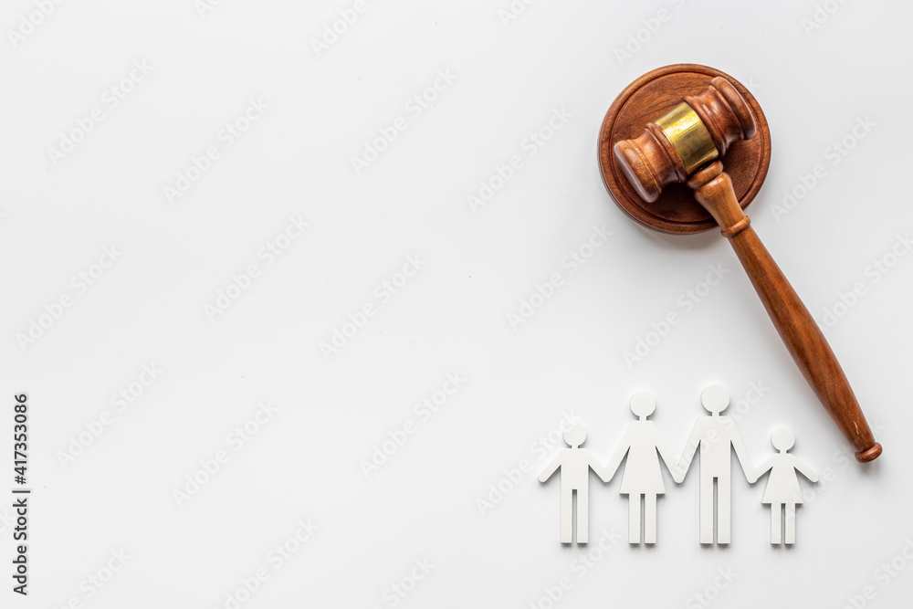 Family figure with judge gavel. Family law concept Family figure with judge gavel. Family law concept