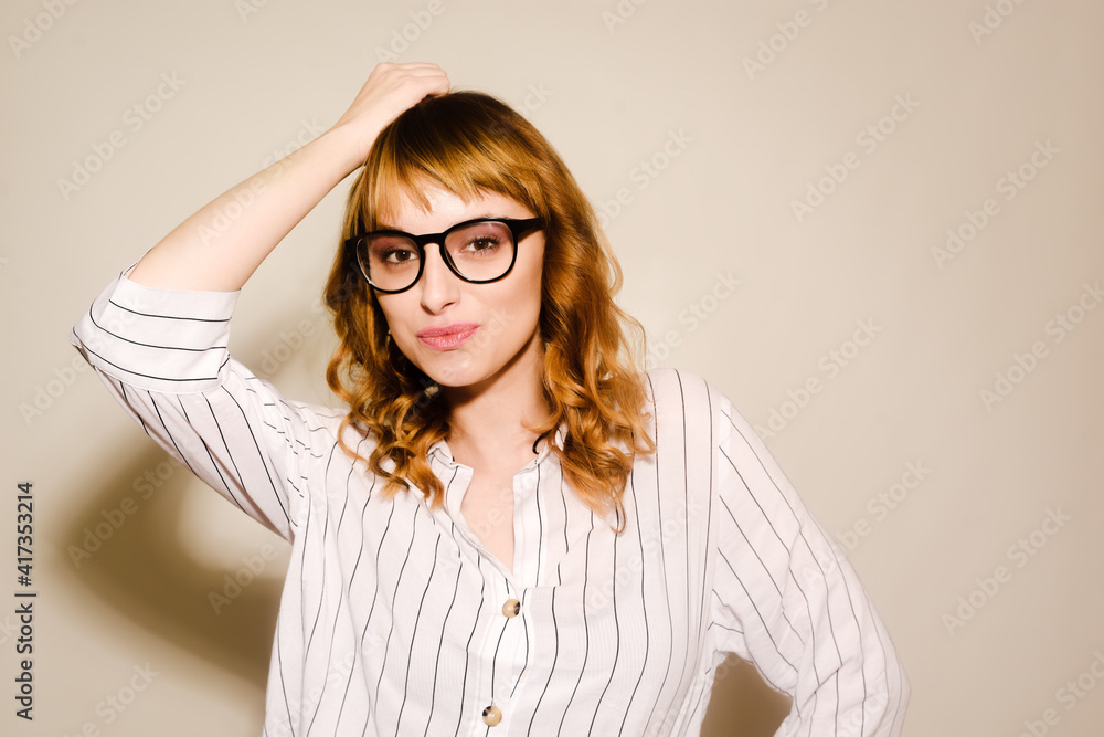 Beautiful girl student in glasses and a shirt. Woman worker cheerful, smiling. Beautiful girl student in glasses and a shirt. Woman worker cheerful, smiling.
