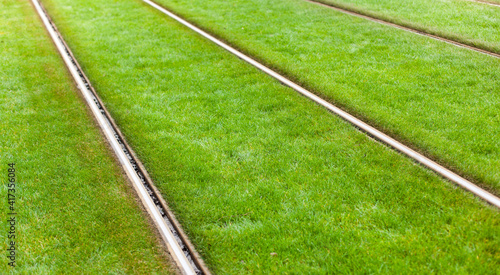 Tram tracks on grass verge. Straßenbahnschienen auf Grünstreifen. 