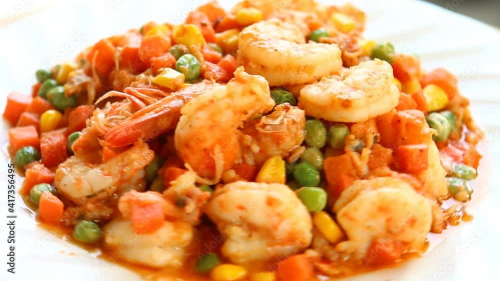Fried prawns with chopped green peas corns and carrots , Thai street food Fried prawns with chopped green peas corns and carrots , Thai street food