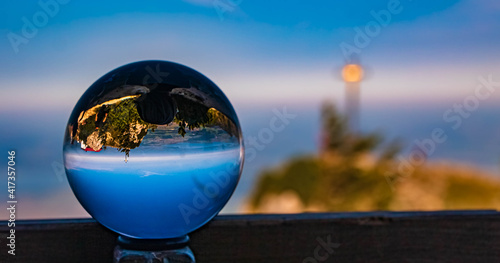 Crystal ball alpine summer landscape shot with a summit cross at the famous Hochfelln summit  Bergen  Bavaria  Germany