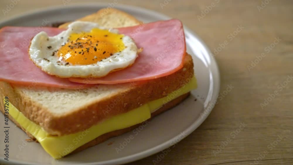 homemade bread toasted cheese topped ham and fried egg with pork sausage for breakfast homemade bread toasted cheese topped ham and fried egg with pork sausage for breakfast