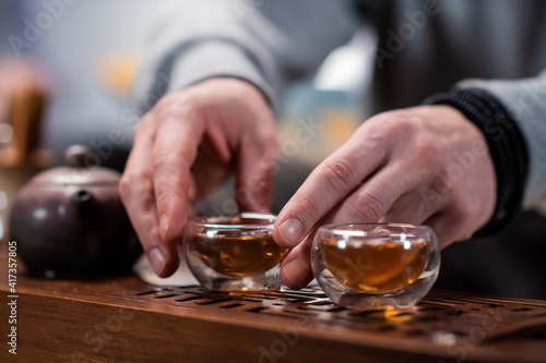 The mystery of a real chinese tea ceremony. The master s hands prepare delicious black tea for the guests of his house