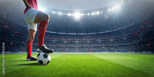 Football player in the stadium. An imaginary stadium is modelled and rendered. © efks