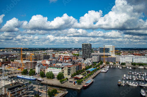 Fototapeta Naklejka Na Ścianę i Meble -  Antwerp, Belgium - July 12, 2019: Aerial view of the city of Antwerp in Belgium on a sunny summer day with beautiful clouds.