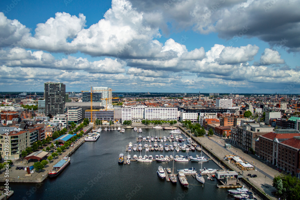 Antwerp, Belgium - July 12, 2019: Aerial view of Antwerp, Belgium, on a sunny summer day with beatiful clouds above the harbor.