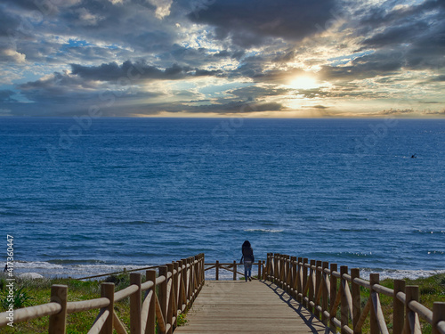 Sandy beach and wooden pier on the Costa del Sol in Marbella  Spain