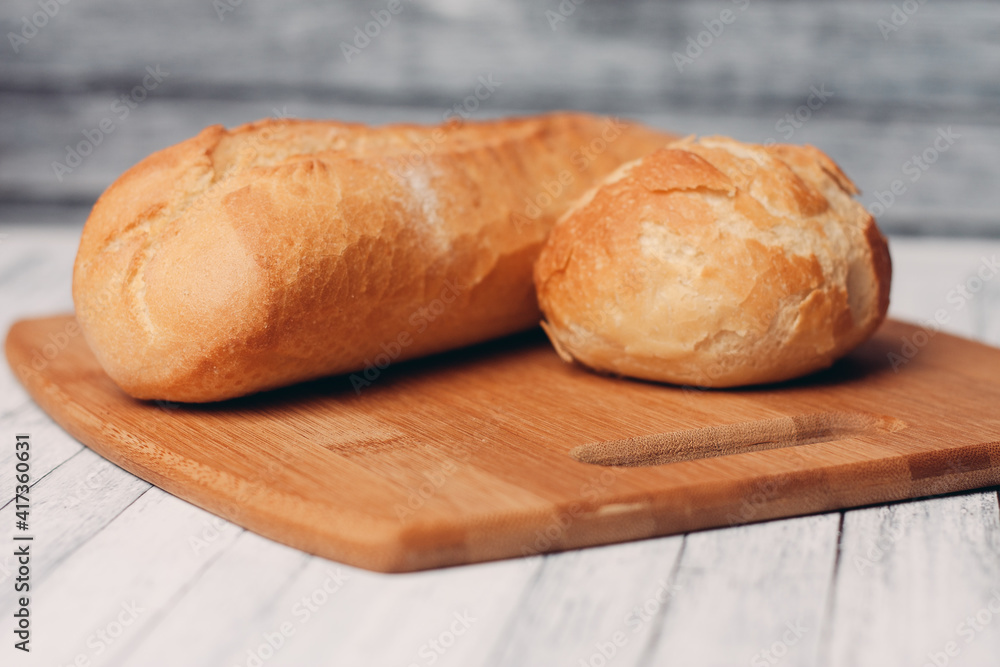loaf with bun fresh baked goods home cooking wood board fresh flavor loaf with bun fresh baked goods home cooking wood board fresh flavor