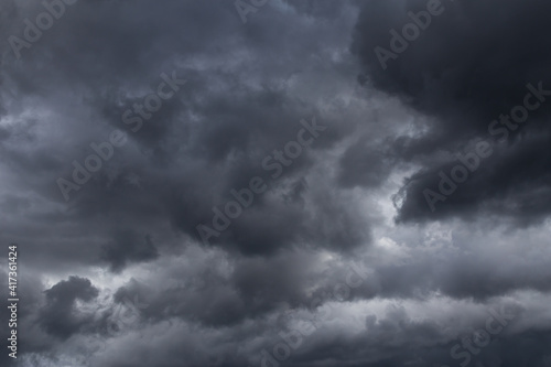 Storm sky with dark grey cumulus clouds background texture, thunderstorm