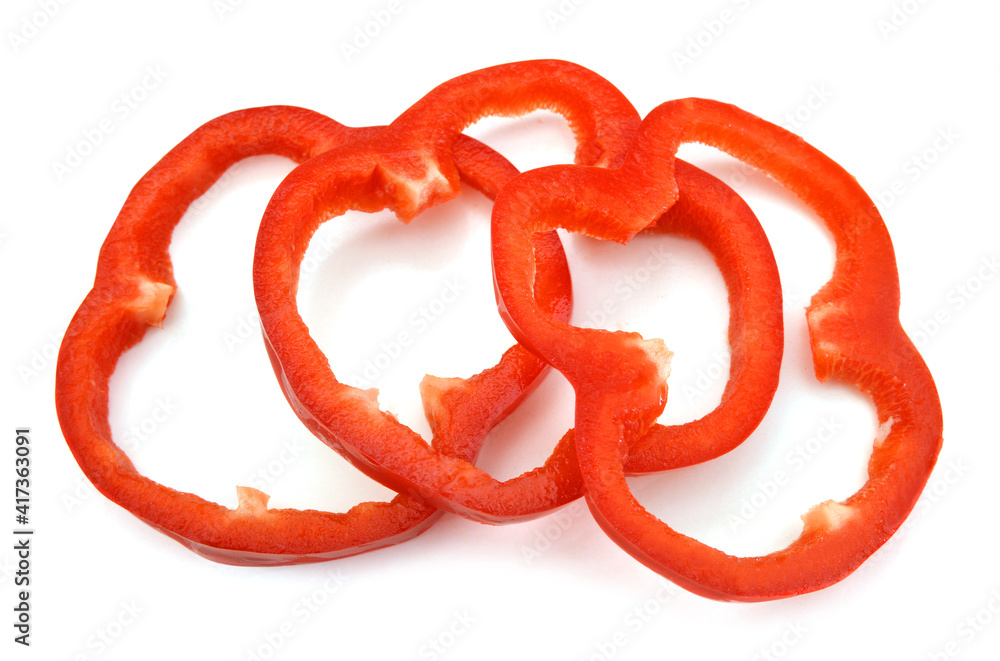 red pepper slices on white background red pepper slices on white background