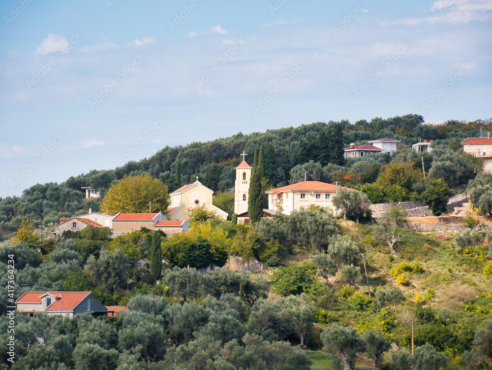 View of Stari Bar in Montenegro with a church tower, residential buildings and rural surroundings