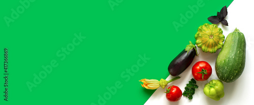 Banner. A group of vegetables is laid out diagonally. Minimalistic modern display concept. Harvest tomatoes, zucchini, squash.