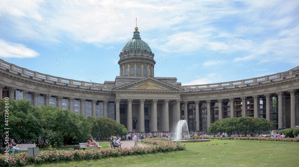   Tourists visiting and resting near Kazan Cathedral