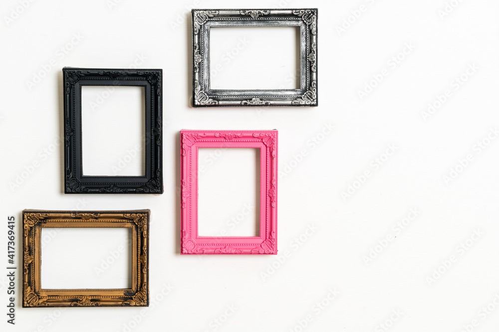empty picture frame on white wall background empty picture frame on white wall background