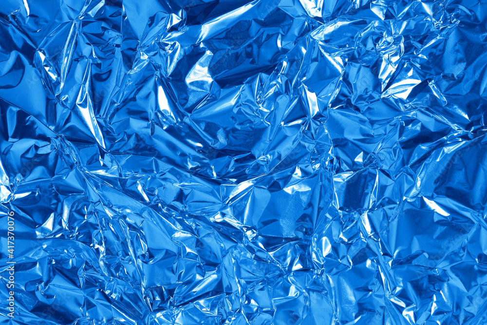 Blue metallic foil shiny texture, wrinkled wrapping paper for
